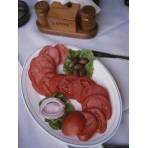  Sliced Roma Tomatoes Fill a Plate at Samis Restaurant in 