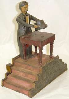 Antique J&E Stevens Magician Mechanical Cast Iron Bank  