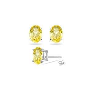  1.21 Cts 6x4mm Oval Yellow Sapphire Stud Earrings in 