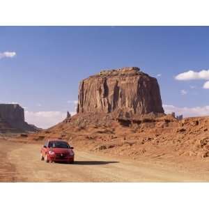  Car on Valley Drive Road Beneath Merrick Butte, Monument Valley 